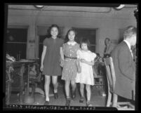 Three Chinese American girls who found a $100 bill, circa 1940