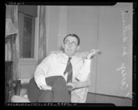 Carey McWilliams seated in chair, Los Angeles, Calif., circa 1941