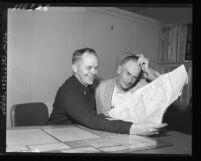 Lost driver Charlie Abboud from Omaha gets help from Lt. C. A. Kirby, who explains LA freeway system, Calif., 1959