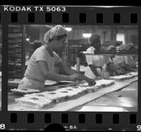 Workers making carrot cakes at Van de Kamp's bakery in Los Angeles, Calif., 1988