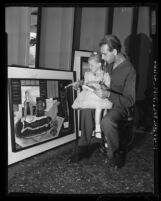 Holly Hanson sits on lap of artist Nico Van Den Heuvel as he waits to testify on behalf of the Gas House, Venice