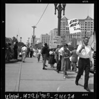Congress of Racial Equality members with placards supporting the Freedom Riders picketing in Los Angeles, Calif., 1961