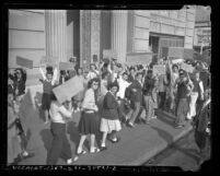 Los Angeles high school students picketing against Gerald L. K. Smith at the Chamber of Commerce Building, Los Angeles, 1945