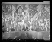 Burbank Mayor Paul L. Brown, seated in the city council chamber before the "Four Freedoms" mural, circa 1946