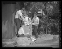 Young people attending Jewish camp examining Ark of Torah in Pacific Palisades, Calif., 1950