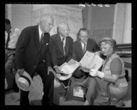 Members of First United Presbyterian Church looking over timecapsule found under cornerstone of church in Los Angeles, Calif., 1950