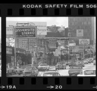 Street scene with billboards lining Sunset Blvd. near Larrabee in Los Angeles, Calif., 1979