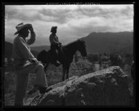 Mark Golsh, chief of the Rincon Indian Reservation, and cowboy Max Calac look over home land region in San Diego County, Calif., 1959