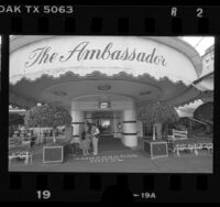 Guests at entrance to Ambassador Hotel on day of closing, Los Angeles, Calif., 1989