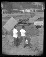 Youngsters selling lemonade to construction workers on the Golden State Freeway, Los Angeles, 1960