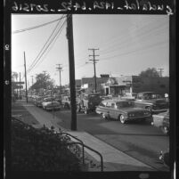 Rush hour traffic and street scene in Santa Ana, Calif., 1961