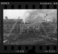 Firemen fighting blaze at Star Theater at 5446 Hollywood Blvd. in Los Angeles, Calif., 1976
