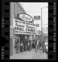 People lined up outside Laemmle's Royal movie theater showing 