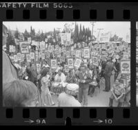 Demonstrators holding "Stop Big Oil" pickets during rally at Dolphin Park in Carson, Calif., 1979