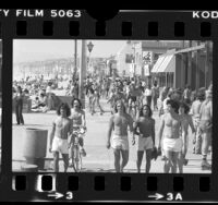 People along boardwalk at Hermosa Beach, 1980