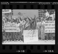 Demonstrators with sign reading "Death To The Shah, Bakhtiar" protesting at the Federal Building in Los Angeles, 1980
