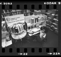 Information specialist Sylvia Curtis answering telephones for Community Access Library Line (CALL) in Montebello, Calif., 1980