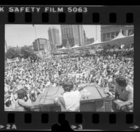 View from stage looking out at crowd as National Organization for Women's Eleanor Smeal, speaks at ERA rally in Detroit, Mich, 1980