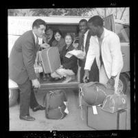 Group loading bus headed to Sacramento fair housing law hearing, Los Angeles, Calif., 1963