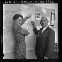 City administrator Telpher Wright and Grace Black illustrating new city boundary lines for El Monte, Calif., 1963