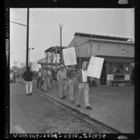 Pickets from U.A.W. Local 216 at front gate of General Motors Buick-Oldsmobile-Pontiac plant during strike in South Gate, Calif., 1963