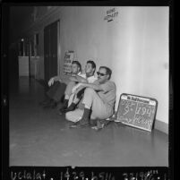 Three CORE hunger strikers sitting in hallway at Los Angeles Board of Education Building, 1963