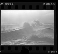 Waves crashing over seawall near Cabrillo Beach, Calif., 1978