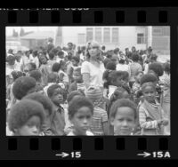 White teacher Sandra Parks and African American school children at school in Watts, Calif., 1978