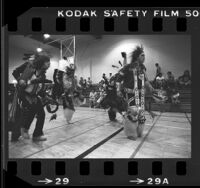 Four Native American Indians practicing dance in a gym in Los Angeles, Calif., 1980
