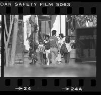 People walking around Little Tokyo in Los Angeles, Calif., 1983