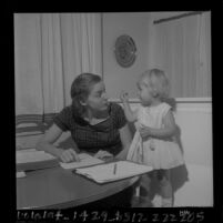 Barbara Pampalone, the only woman in USC School of Dentistry freshmen class of 1963, studying with her daughter, 1963