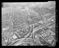 Aerial view of construction of Santa Monica Freeway at San Diego Freeway interchange in Los Angeles, 1963