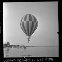 Pilot Mark M. Semich landing a hot air balloon in preparation for Catalina Channel race, Calif., 1963