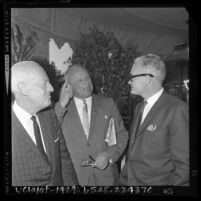 Barry Goldwater talking with his California campaign chairman, William F. Knowland and unidentified man, 1964