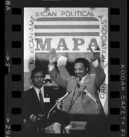 Presidential candidate, Jesse Jackson at podium addressing Mexican American Political Association in San Jose, Calif., 1984