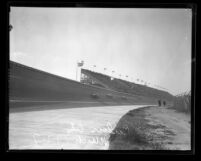 Race cars in turn passing grand stands during race at Culver City Speedway, Calif., 1927