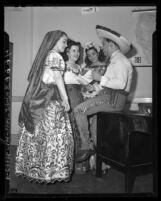 Amalia Franco, Margarita Parra, Lupita de Buelna, Francisco H. Ochoa of Club Mexicano de Los Angeles discussing plans for Baile Ranchero, 1947