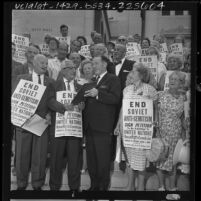 Los Angeles Mayor Samuel W. Yorty signing petition protesting Soviet anti-Semitism placard wearing members of Jewish Labor Committee, 1964