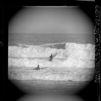 Two surfers in the waves at Redondo Beach, Calif., 1965