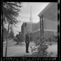Pastor Harold L. Fickett Jr. standing out front First Baptist Church in Van Nuys, Calif., 1965
