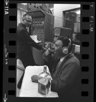 UCLA professor Richard F. Docter conducting an experiment on Phillip Zuckerman, 1965