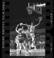 USC's basketball player Cheryl Miller tips away a rebound from California's Heli Toikka and Cynthia Cooke, 1984