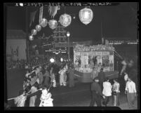 Parade float and marchers in Autumn Moon Festival in Los Angeles' Chinatown, 1941