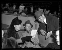 Boxer Ceferino Garcia with actors George Raft and Norma Shearer at Santa Anita Racetrack, Calif., 1940