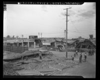 Collapsed shops, shattered windows, broken telephone lines at Ninth St. after earthquake in Imperial, Calif., 1940