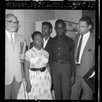 Attorney A. L. Wirin with Rena Frye and her sons, Ronald and Marquette at Los Angeles courthouse, 1965