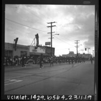 Centennial High School Apaches Girls Drill Team in the Watts Christmas parade, Los Angeles, Calif., 1965