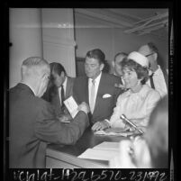 Ronald Reagan with wife, Nancy filing nomination papers for governorship, Calif., 1966