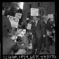Mayor Samuel W. Yorty surrounded by UCLA students who oppose Yorty's support of the Vietnam War, Los Angeles, Calif., 1966