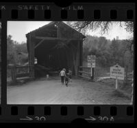 Two children entering Bridgeport Covered Bridge on the Yuba River, Calif., 1966